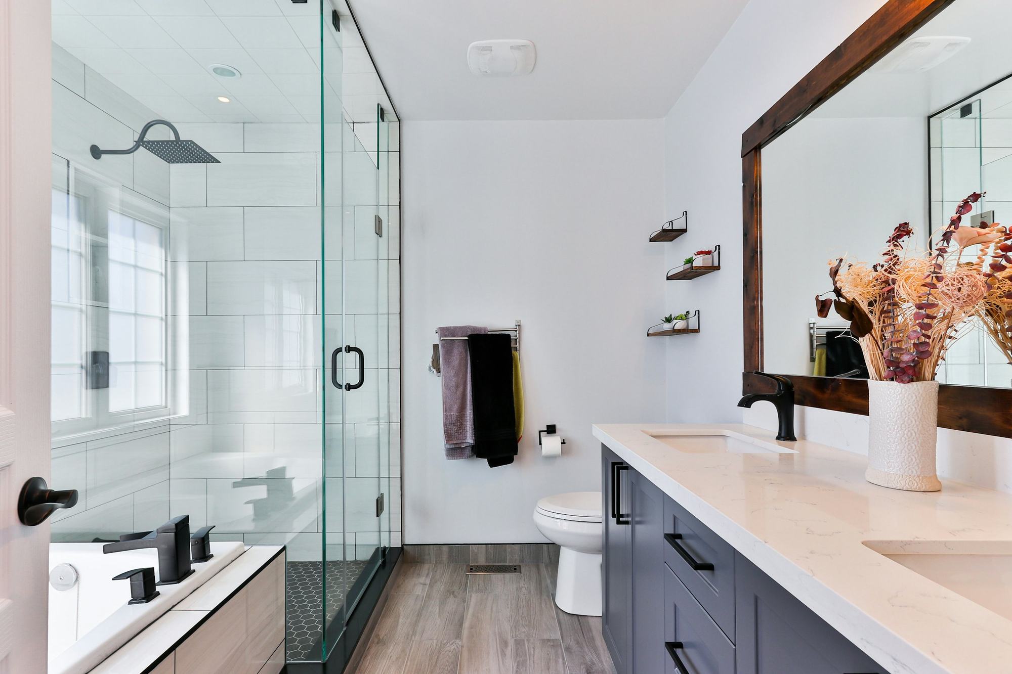 Remodeled bathroom with glass shower and vanity