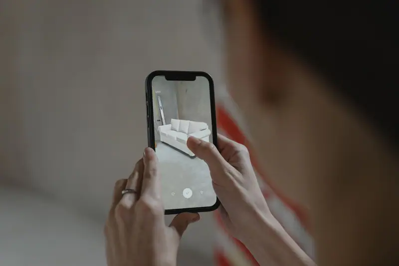 Person taking a photo with a smartphone indoors