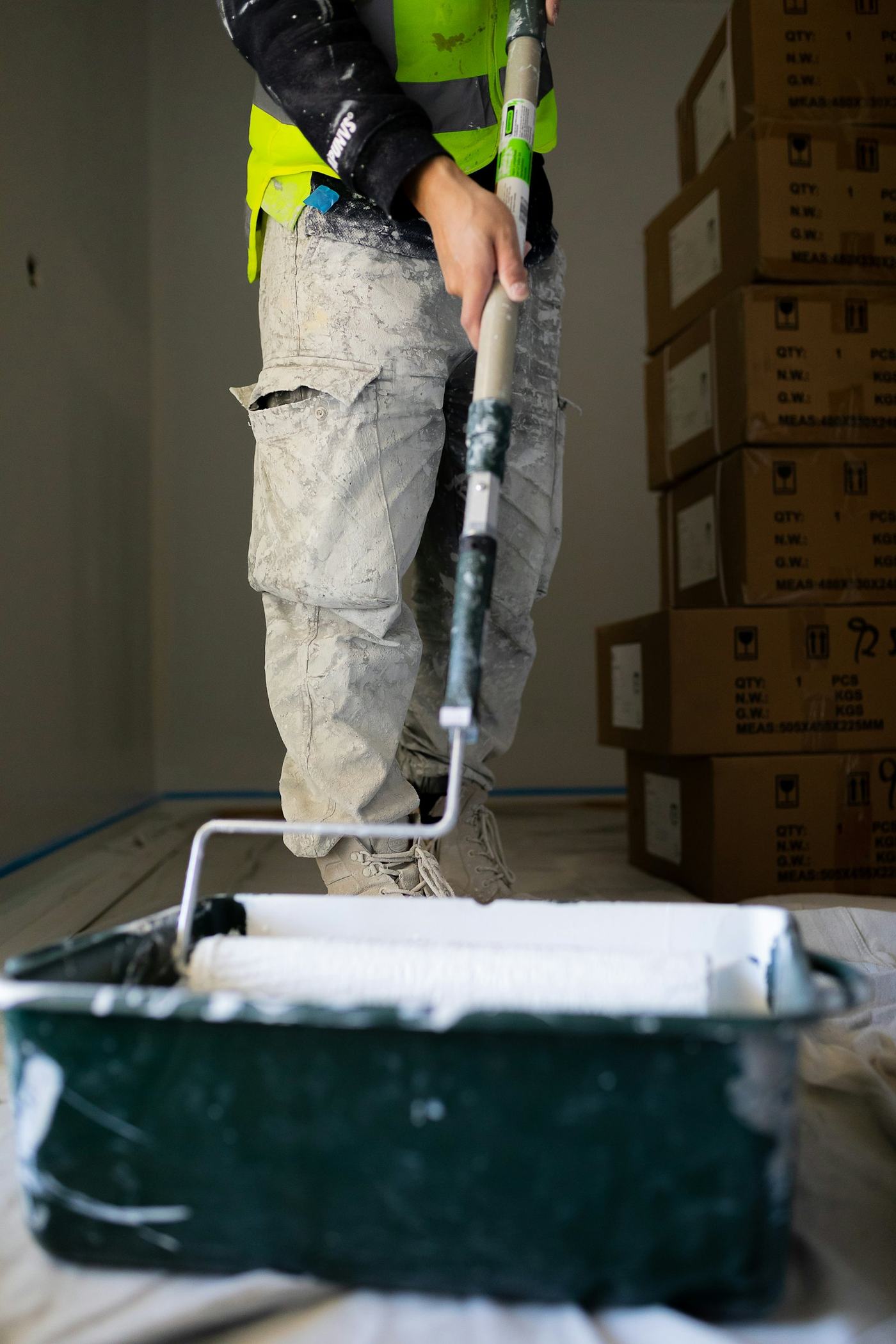 Painter loading a roller